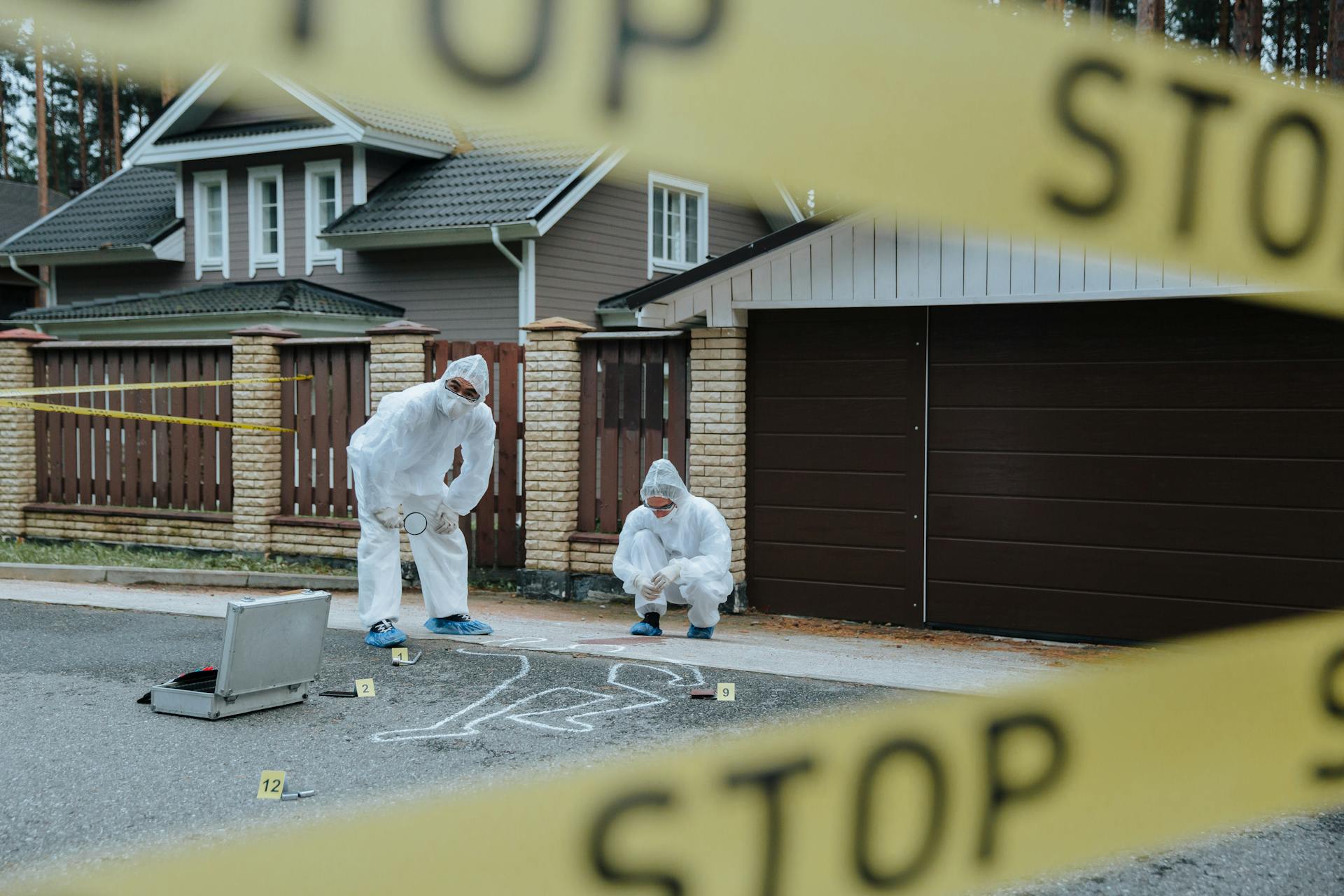 Police officers investigating a house in Jammu’s Talab Tillo neighborhood after a retired principal and his wife were found dead inside under suspicious circumstances.