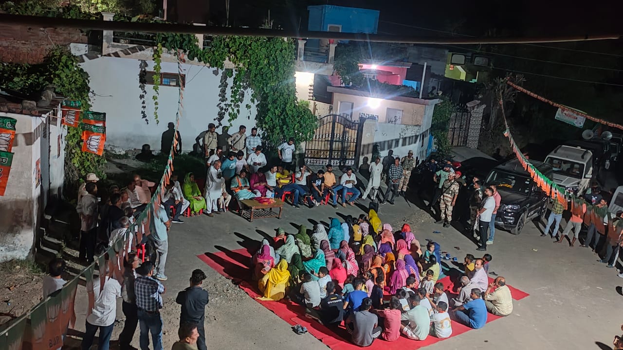 Ranbir Singh Pathania, BJP leader and former MLA of Ramnagar, addressing the crowd at Phangial Panchayat, discussing road repairs and water supply improvements.

